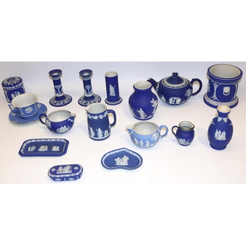 411 - Collection of Wedgwood dipped blue jasperware, incl. teapot, pair of candlesticks, four jugs, cup an... 