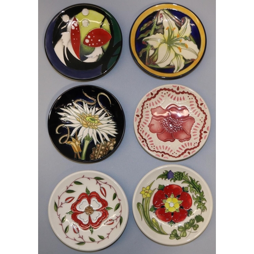 668 - Moorcroft Pottery: six MCC Moorcroft Collectors' Club pin dishes/coasters - lily flower design on da... 