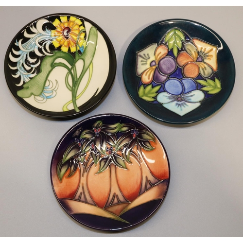 670 - Moorcroft Pottery: three MCC Moorcroft Collectors Club pin dishes/coasters - 'Triple Choice', decora... 