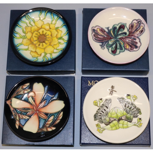 675 - Moorcroft Pottery: four MCC Moorcroft Collectors Club pin dishes/coasters - 'Panache', peach flower ... 