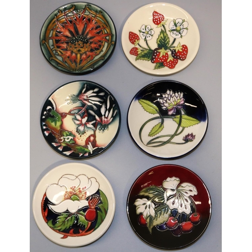 697 - Moorcroft Pottery: six pin dishes/coasters, designed by Nicola Slaney - 'Crimson Cornflower' dated 2... 