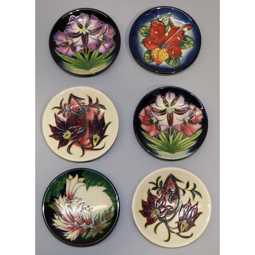 703 - Moorcroft Pottery: six pin dishes/coasters, designed by Philip Gibson - purple flowers on graduated ... 