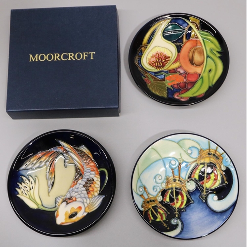 717 - Moorcroft Pottery: three pin dishes/coasters - 'Quiet Waters', designed by Philip Gibson, 2002; 'I s... 