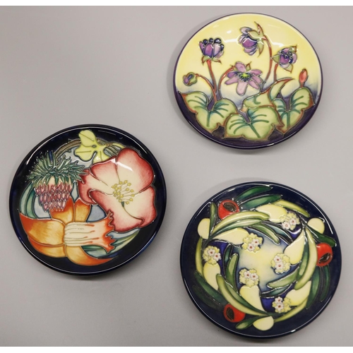 719 - Moorcroft Pottery: three pin dishes/coasters, designed and signed by Emma Bossons - 'Hepatica', 1999... 