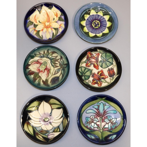 720 - Moorcroft Pottery: six pin dishes/coasters - 'Hellebore' designed by Nicola Slaney, '99; 'Cleopatra'... 