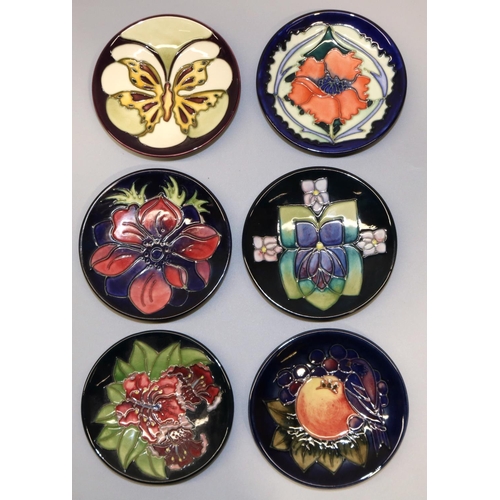 727 - Moorcroft Pottery: six pin dishes/coasters - Finches on purple ground, 1992; anemone on dark blue gr... 