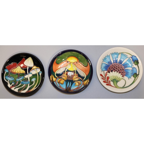 653 - Moorcroft Pottery: three pin dishes/coasters, designed and signed by Emma Bossons - 'Pixie Parasols'... 