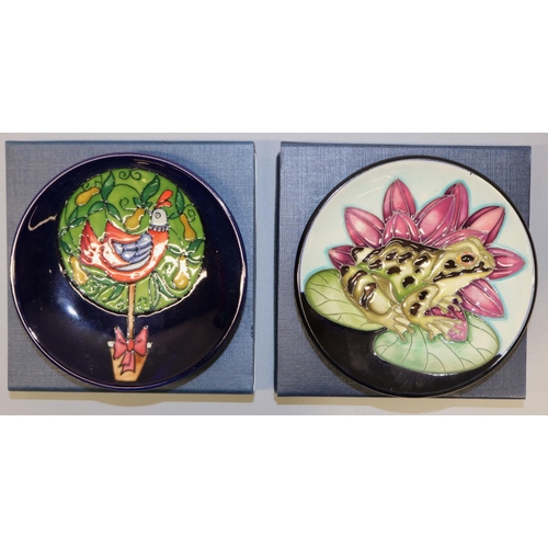 664 - Moorcroft Pottery: two trial pin dishes/coasters - frog on a lily pad, dated '20; and a partridge in... 