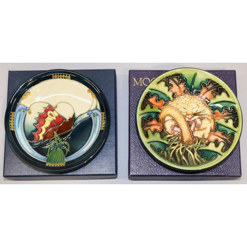 679 - Moorcroft Pottery:  two MCC Moorcroft Collectors Club pin dishes/coasters, both initialed PH for Pau... 