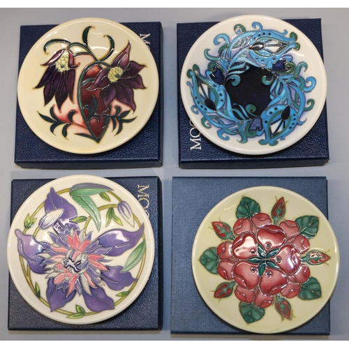 682 - Moorcroft Pottery: four trial pin dishes/coasters - 'Feather Blue', dated 2019; purple flowers on a ... 