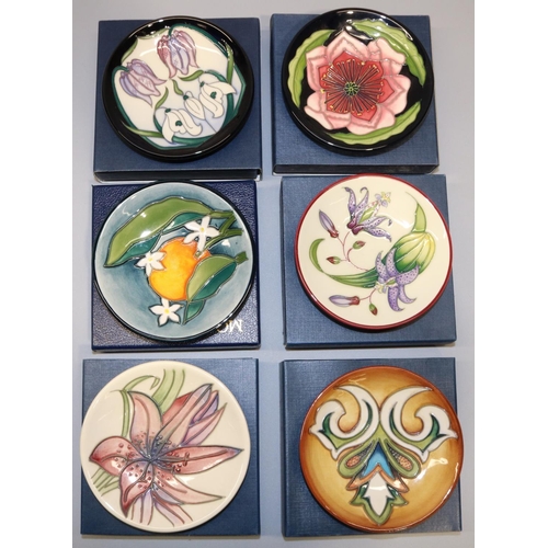 685 - Moorcroft Pottery: six trial pin dishes/coasters - orange with orange blossom on green ground, dated... 