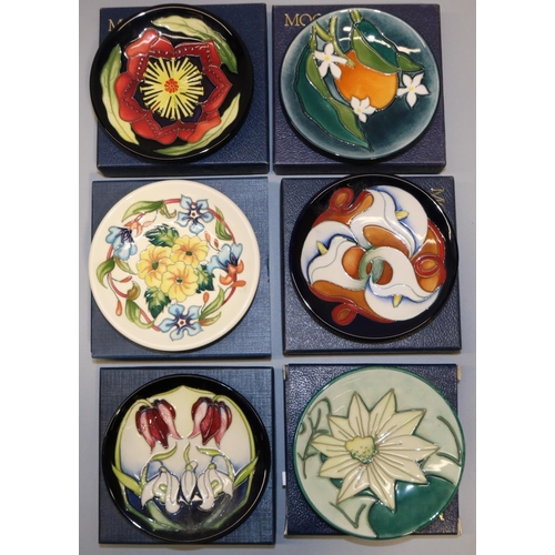 688 - Moorcroft Pottery: six trial pin dishes/coasters - orange with orange blossom, dated '99; white flow... 