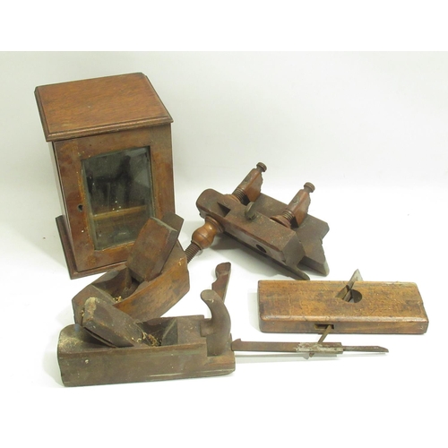 276 - Early C20th oak smokers cabinet with glazed door, late C19th carpenters plane, three similar period ... 