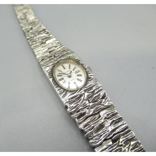 611 - Ladies Rotary silver wristwatch on integral back effect bracelet, signed brushed dial with applied h... 