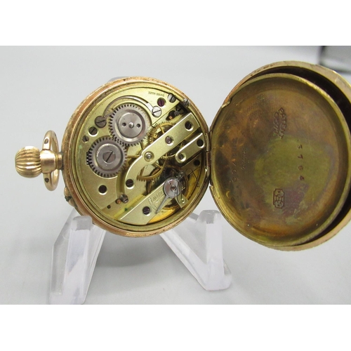 619 - Swiss keyless pin set gold fob watch, white Roman dial enamel, engine turned case with hinged bezel ... 