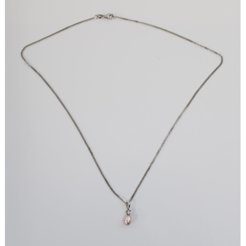 1206 - 18ct white gold necklace, the pendant formed of an egg shaped pearl below small diamond, 5.6g