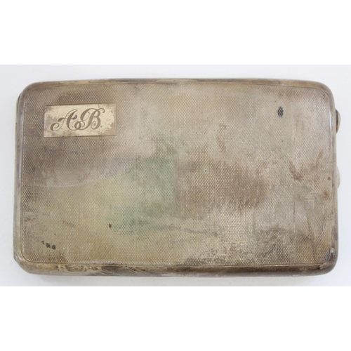 1219 - Hallmarked silver cigarette case, the curved engine turned body opening to reveal silver gilt interi... 