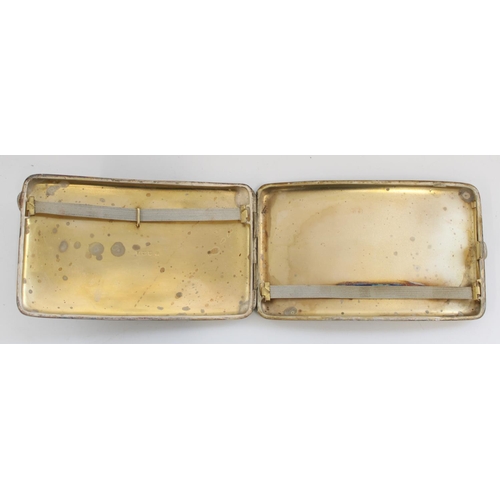 1219 - Hallmarked silver cigarette case, the curved engine turned body opening to reveal silver gilt interi... 