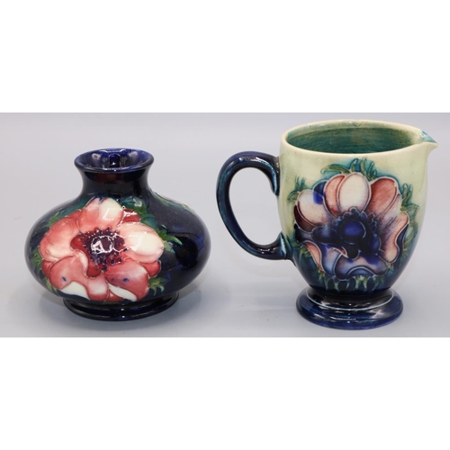 423 - Moorcroft Pottery, anemone pattern - squat vase, H7cm, and a jug, H8cm (2)