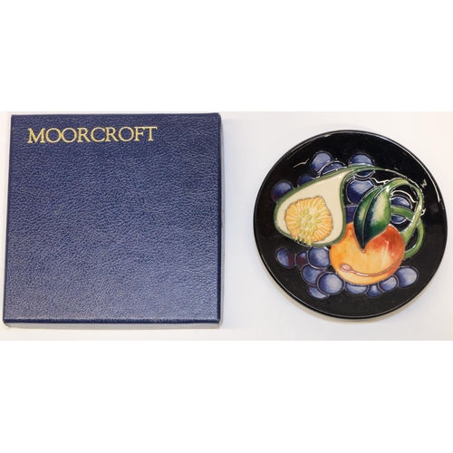 658 - Moorcroft Pottery: pin dish/coaster decorated with peach, fig and blue berries, variant of the 'Quee... 