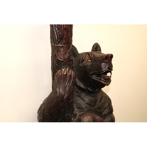 1122 - C19th carved Bear Black Forest hall stand, the parent Bear supporting a trunk with oval mirror, natu... 