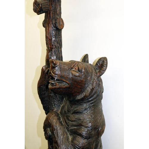 1122 - C19th carved Bear Black Forest hall stand, the parent Bear supporting a trunk with oval mirror, natu... 