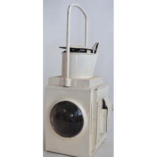 883 - Two Large white painted railway lamps (no internal burners) to include a BR(M) stamped tail lamp wit... 