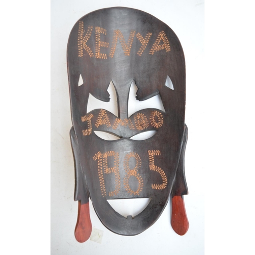 897 - African carved wooden mask and other similar items, a giant Canary Islands cigar, 2 reproduction pis... 