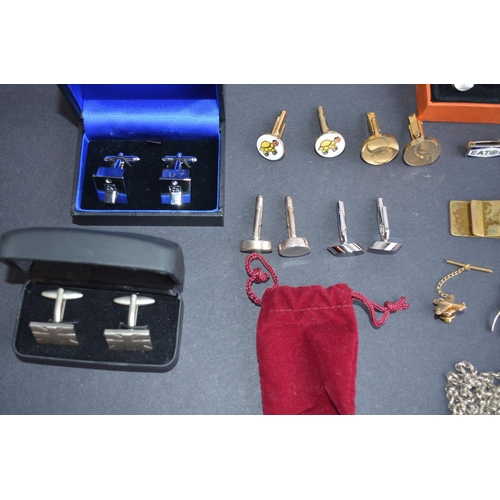112 - Collection of cuff-links, neck chains, pin badges and rings