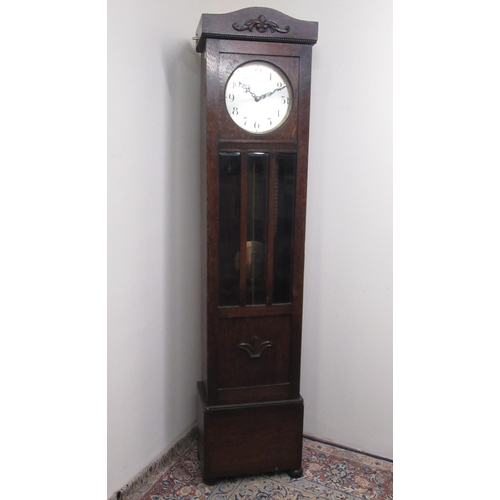 140 - C20th oak long cased clock, with glazed door, circular silvered Arabic dial with three train movemen... 