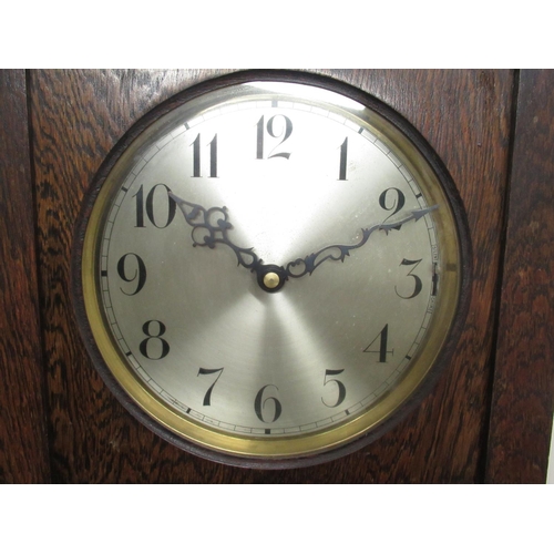 140 - C20th oak long cased clock, with glazed door, circular silvered Arabic dial with three train movemen... 