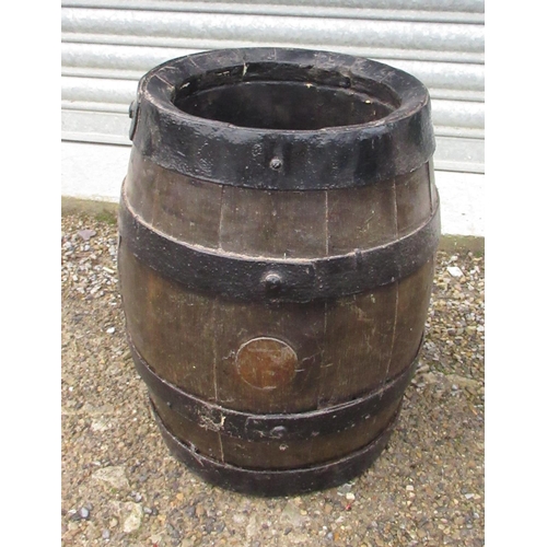 975 - Oak coopered rum barrel, with weighted base, H43cm