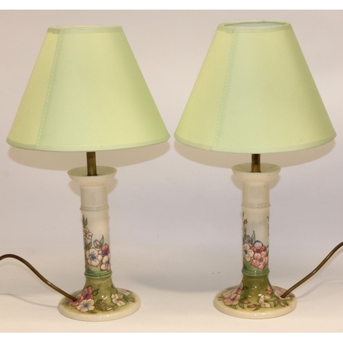 631 - Moorcroft Pottery: pair of Spring Blossom pattern candlestick form table lamps, tube lined decoratio... 