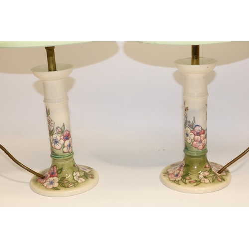 631 - Moorcroft Pottery: pair of Spring Blossom pattern candlestick form table lamps, tube lined decoratio... 