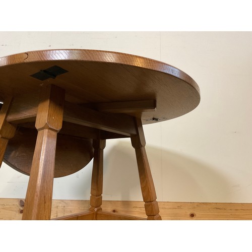 989 - Alan Acornman Grainger, Acorn Industries Brandsby - an oak  oval drop leaf coffee table, on square t... 