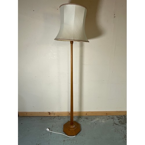 986 - Alan Acornman Grainger, Acorn Industries Brandsby - an oak  standard lamp, faceted column on stepped... 