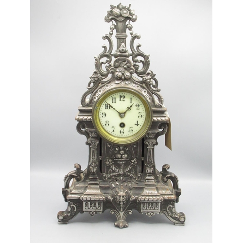 351 - C20th French burnished steel rococo style mantle timepiece, the cast steel case decorated with scrol... 