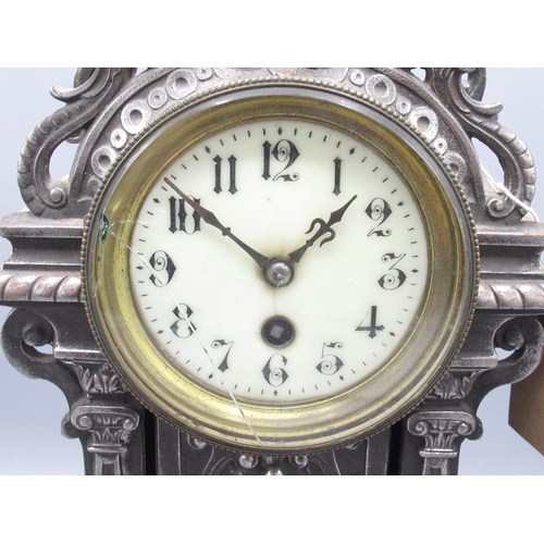 351 - C20th French burnished steel rococo style mantle timepiece, the cast steel case decorated with scrol... 