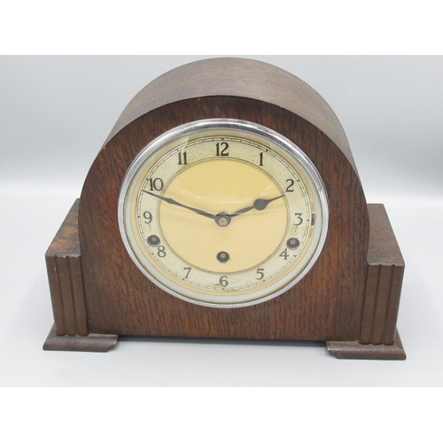 362 - Garrard Clocks Ltd., oak mantle clock, arched top case with applied walnut trim, chrome plated bezel... 