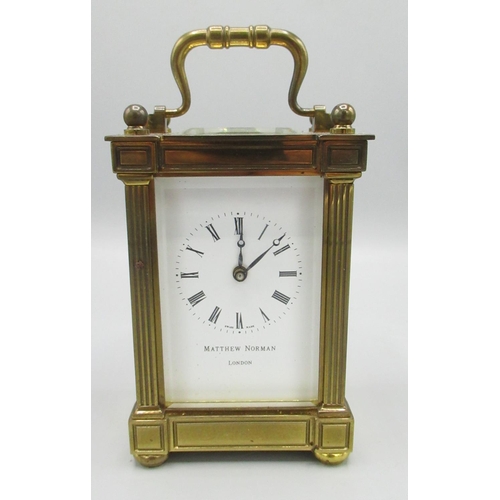 957 - Matthew Norman London - C20th brass carriage timepiece, fluted square section pillars with bevelled ... 