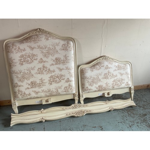 1264 - French single bedstead, with cream painted Toile de Jouy style upholstered arched head and footboard... 