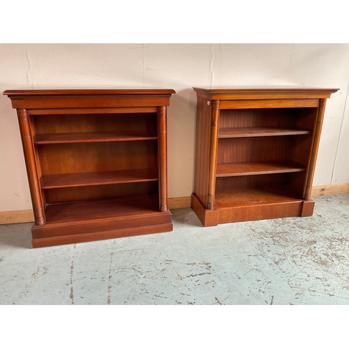 1262 - Two Regency style yew and mahogany finish open bookcases, with two adjustable shelves enclosed by co... 