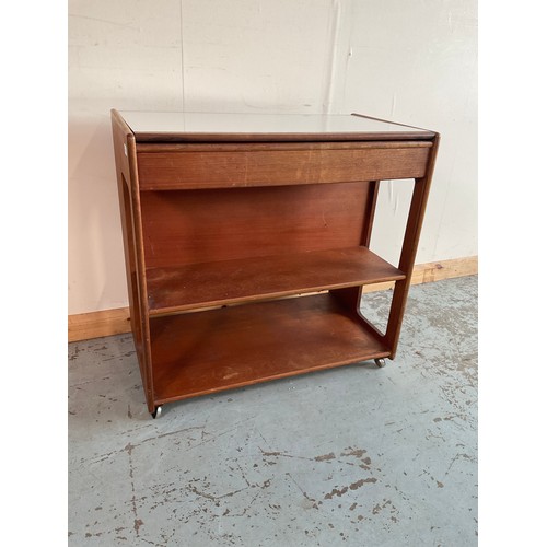 1257 - A. H. Mcintosh & Co Ltd mid-century teak hostess trolley, fitted frieze drawer above two shelves, on... 