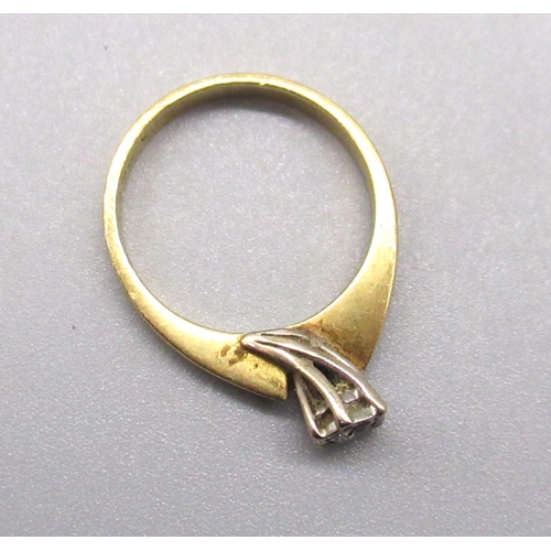 7 - 18ct yellow gold diamond solitaire ring, the brilliant cut diamond in white illusion setting, stampe... 