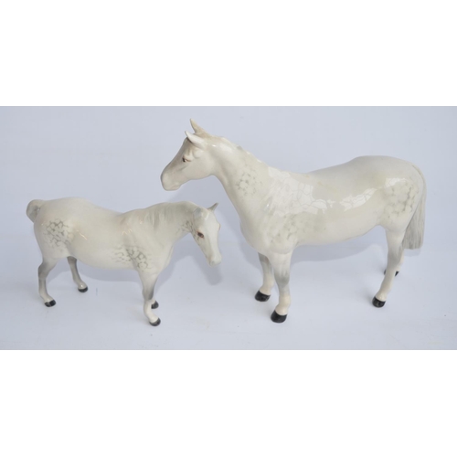 192 - Three Beswick ceramic horse figurines, 2 in gloss finish, 1 matt, larger gloss example with repaired... 