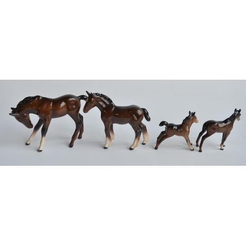 196 - Four Beswick ceramic horses and 2 donkey figurines, no damage or repairs noted. (6)