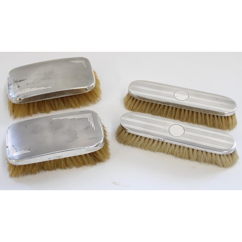 1329 - Four c1920s to 1930s hallmarked silver dressing table brushes with engine turned decoration, max W15... 