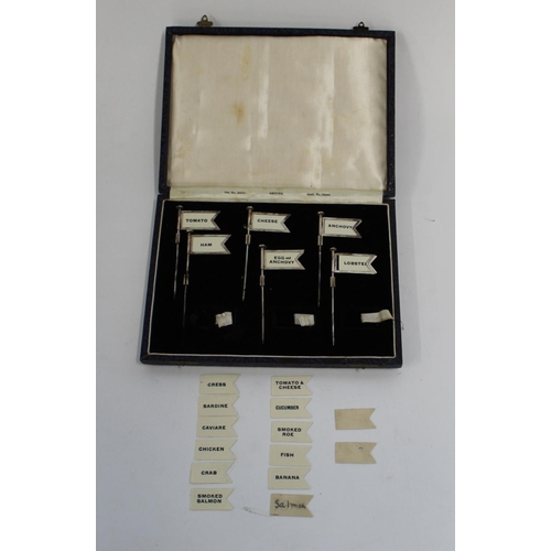 428 - Cased set of hallmarked silver sandwich flags, Birmingham 1929, consisting of 6 flagpoles and 20 fla... 