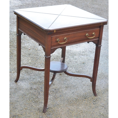 1365 - An Edwardian mahogany card table with envelope top, single frieze drawer on square tapering out-spla... 