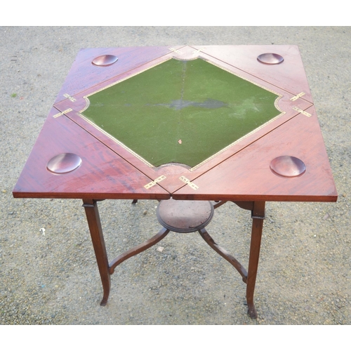 1365 - An Edwardian mahogany card table with envelope top, single frieze drawer on square tapering out-spla... 